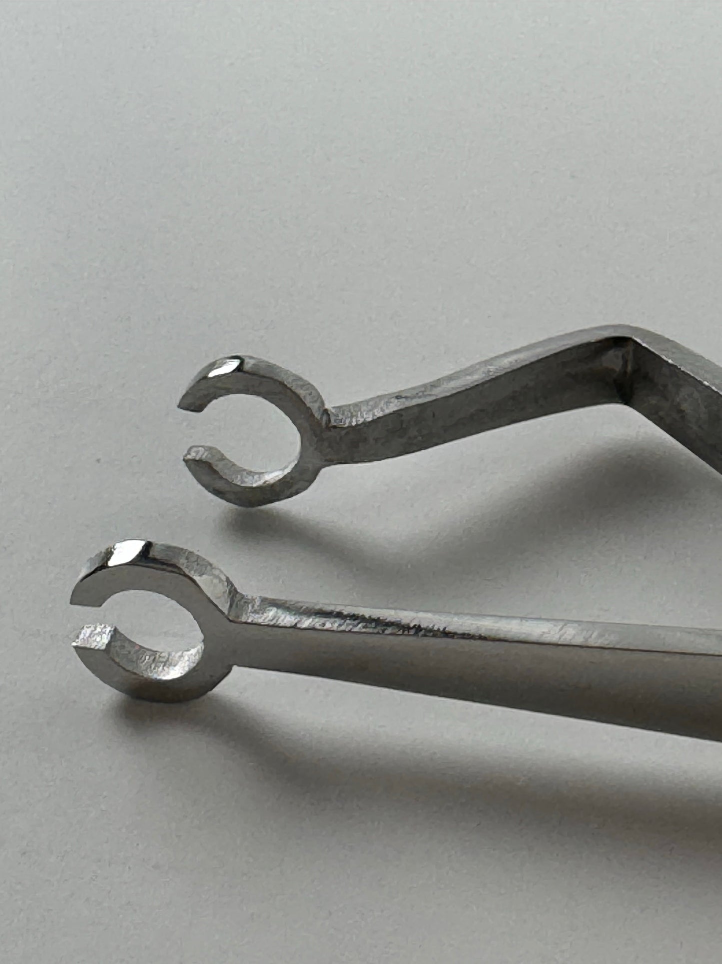 Universal Slotted Piercing Tweezers with Bend